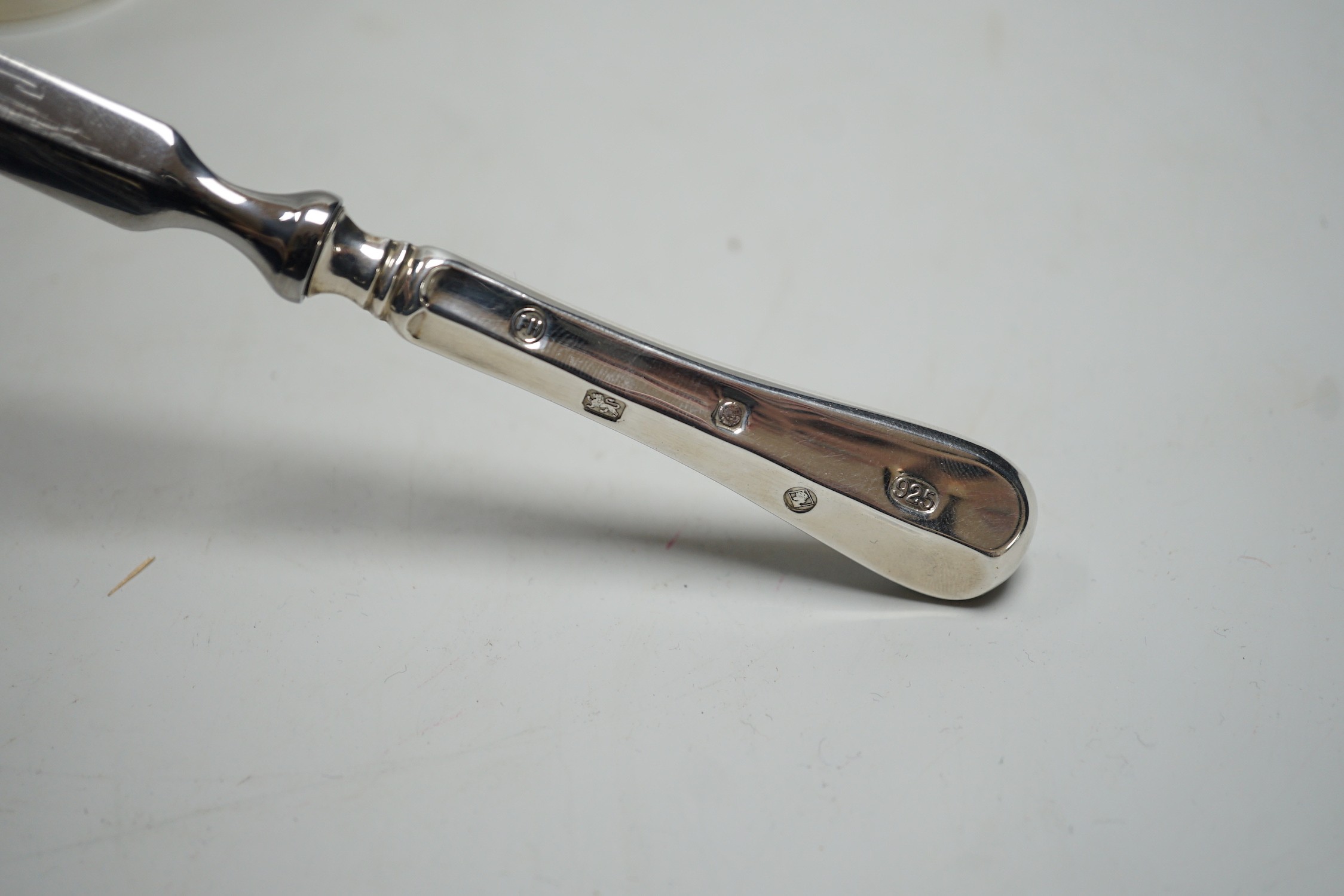 A modern pair of silver mounted salt and pepper mills, boxed, 10.2cm, maker, W.E.V, together with a boxed modern silver handle paper knife.